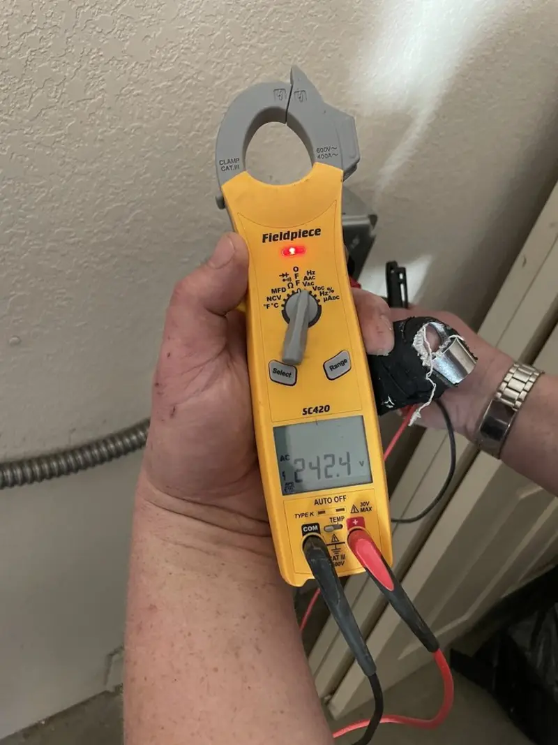 Voltage testing with clamp meter during Generator Installation in Avondale Estates